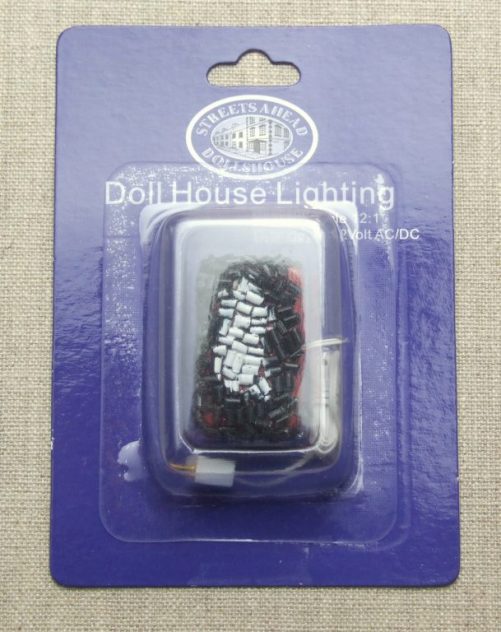 Dolls house glowing coals in packet